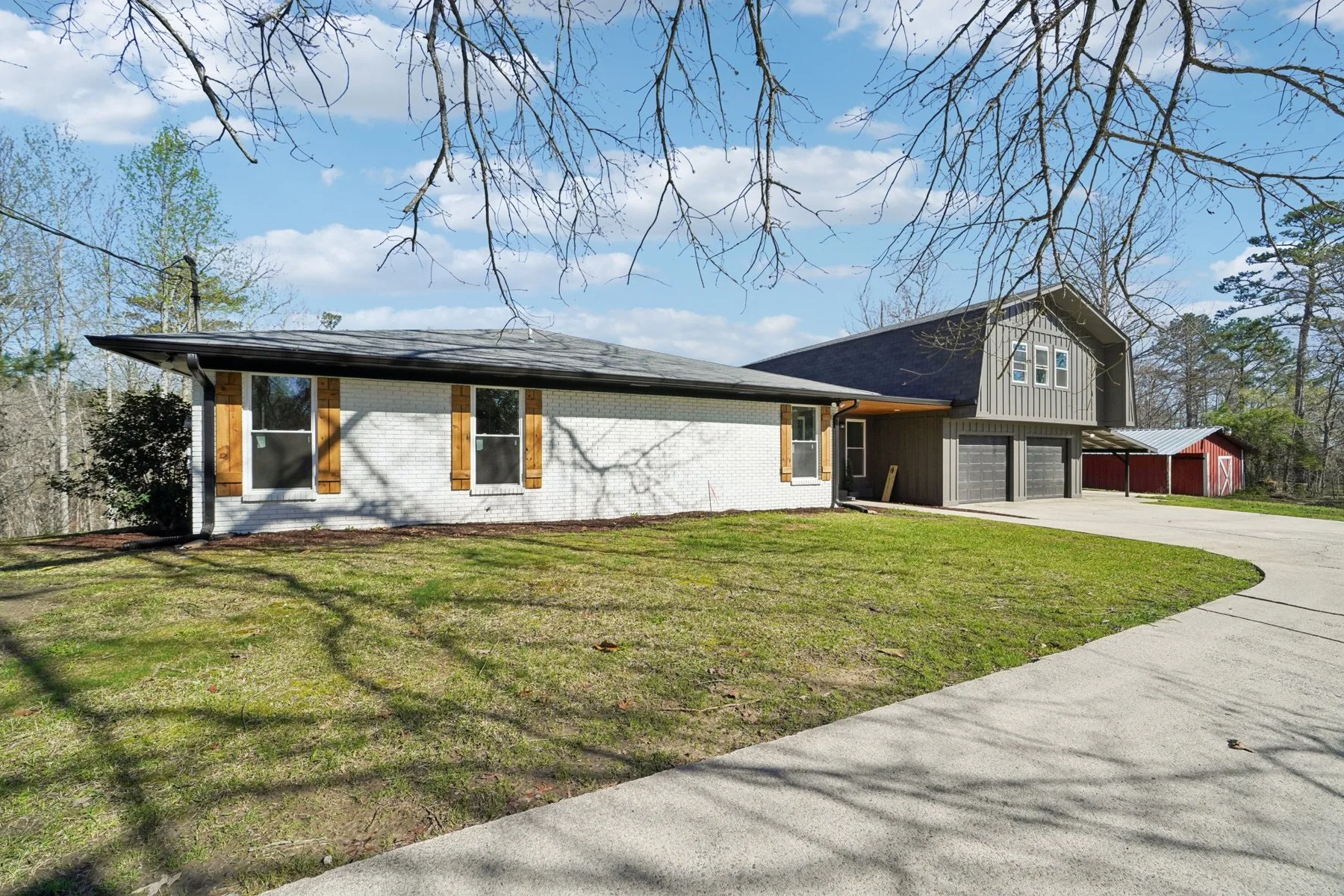 Painted brick home with contrasting siding