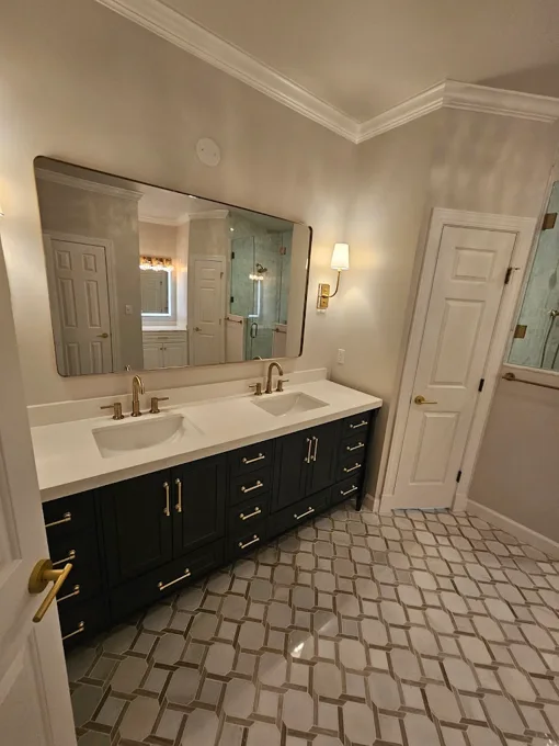 Bathroom vanity and patterned tile finishes