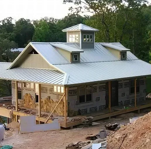Metal roof with cupola on a home under construction