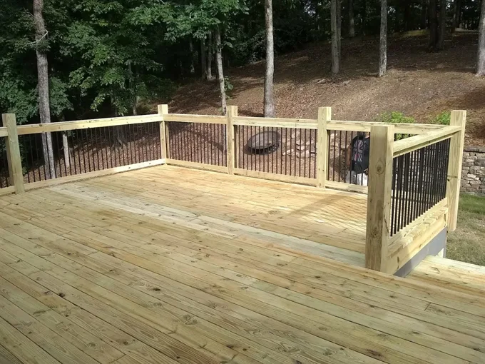 Wood deck with black metal balusters